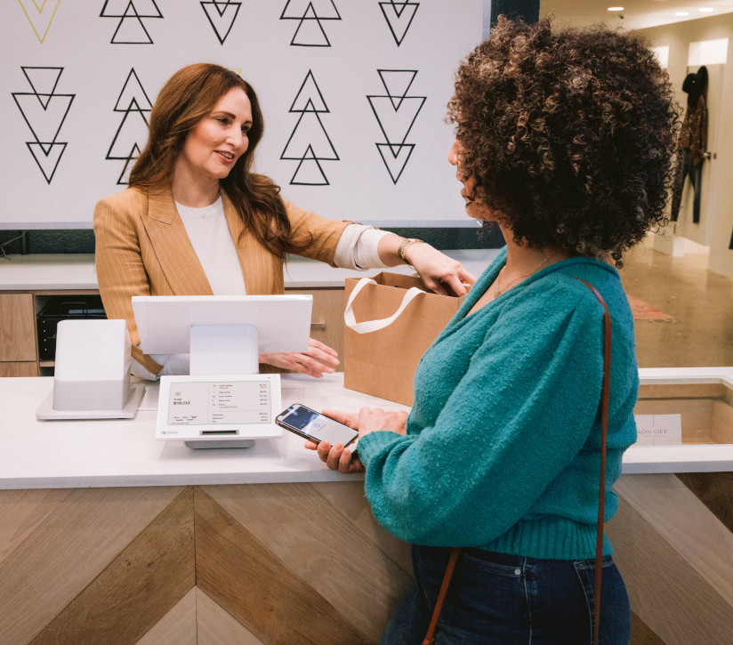 Merchant and customer using Clover POS